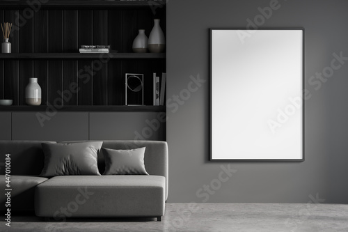 Banner in the dark grey living room with sofa and shelves photo