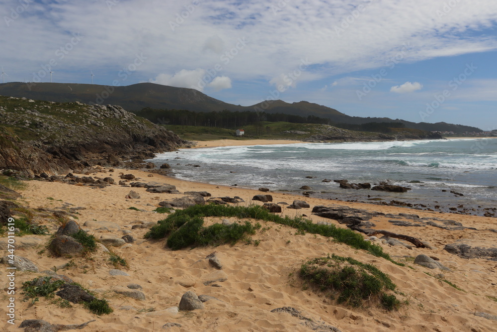 Galicia, Spain, surrounded by mountains and a house in the background. Galicia, Spain, surrounded by mountains and a house in the background.