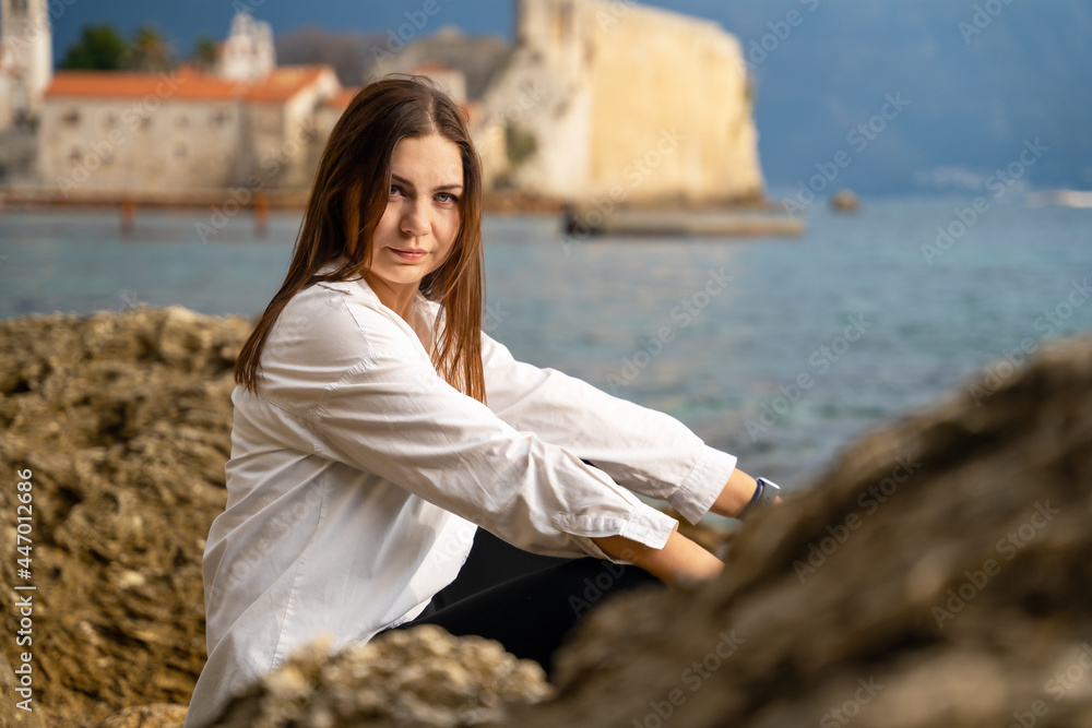 attractive brunette woman on white shirt was tired of her former life and job, so she ran away from problems and went on vacation to reboot, change her lifestyle and rest.