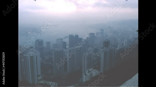 Victoria Harbour cityscape from Victoria peak in Hong Kong, China. Historic archival in 1987 with old port and vintage skyscrapers buildings in Lung Fu Shan district. photo