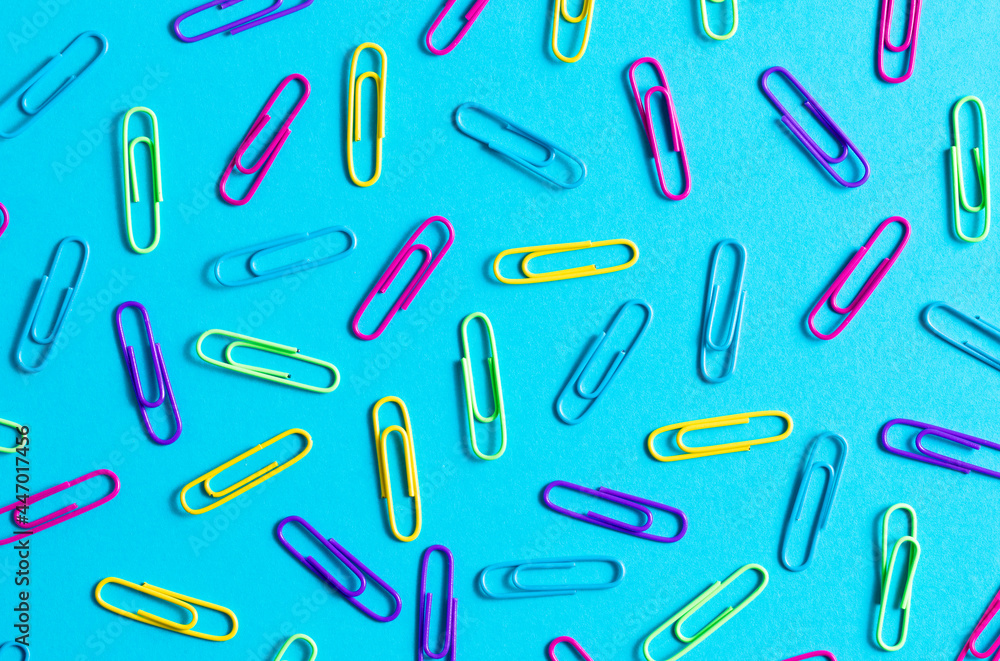 Rainbow Paperclips on a Blue Background Rainbow Paperclips on a Blue Background