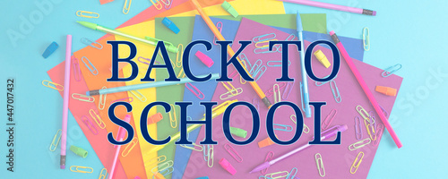 Background of Rainbow Colored School and Office Supplies