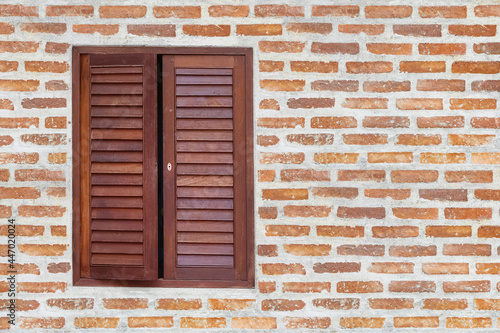 Wooden window on brick wall texture background