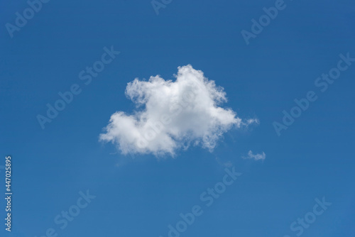 Blue sky with white cloud. Single cloud