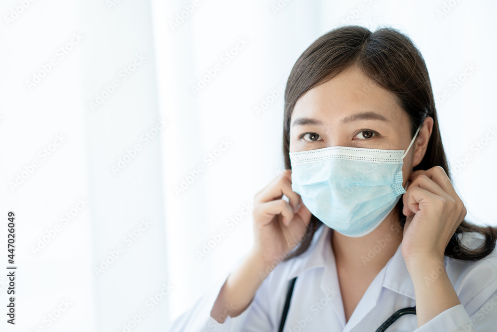 Asian female doctor using laptop computer for working in hospital. Asian female doctor using laptop computer for working in hospital.