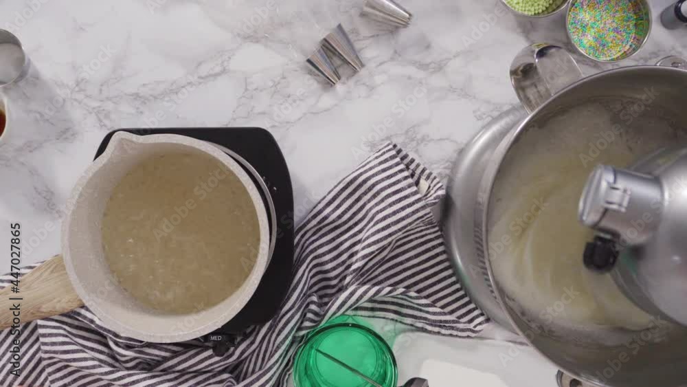 Flat lay. Caramelizing sugar in a saucepan for Italian buttercream frosting. Flat lay. Caramelizing sugar in a saucepan for Italian buttercream frosting.