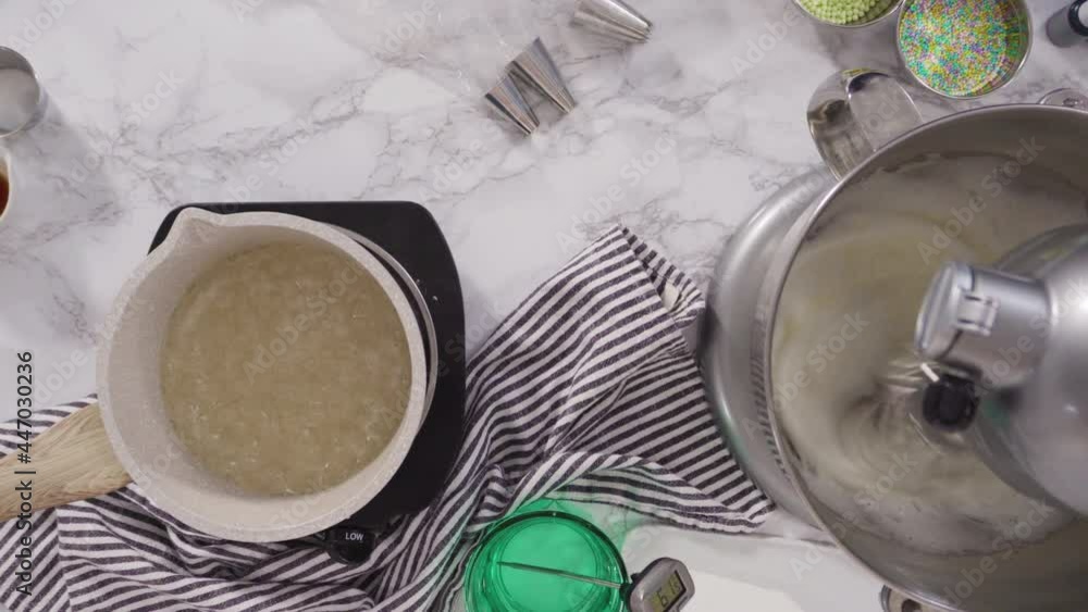 Time lapse. Flat lay. Caramelizing sugar in a saucepan for Italian buttercream frosting.