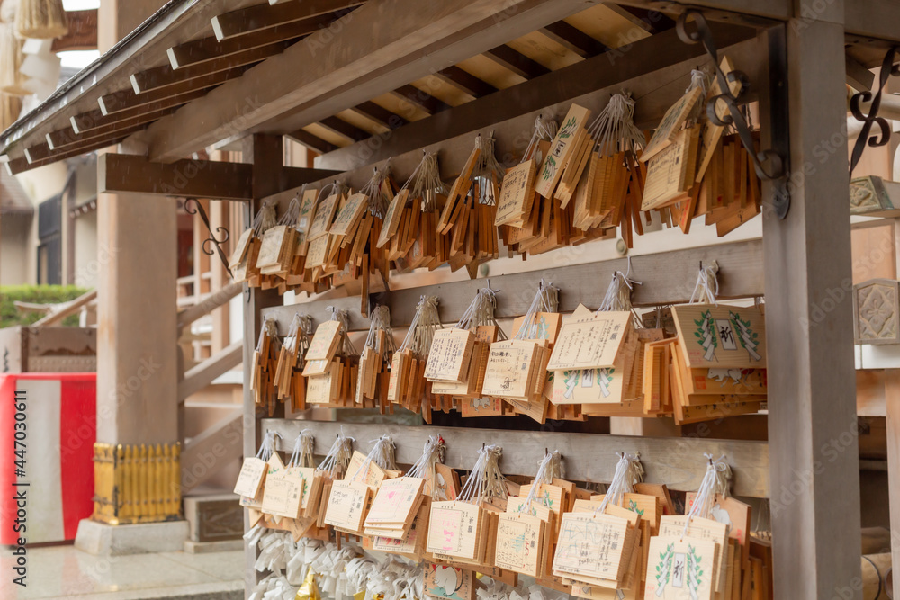 displayed a lot of ema that is a small wooden board on which someone's hope written in shitotomaekawa shrine, kanagwa pref, japan