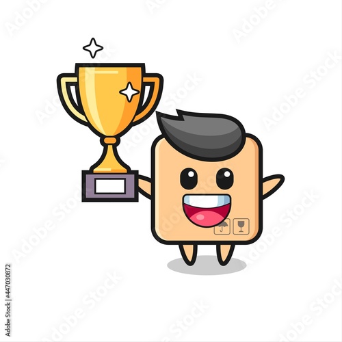 Cartoon Illustration of cardboard box is happy holding up the golden trophy photo