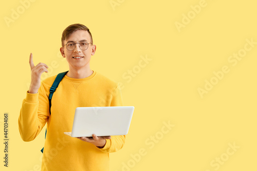 Male student with laptop on...
