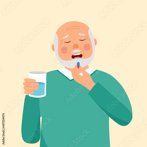 Senior man taking medicine for illness treatment. Old man take vitamin or supplement capsule pill with water.