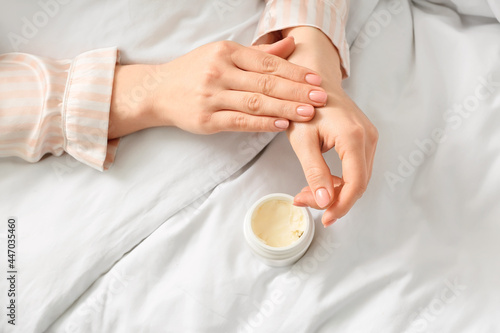 Photography Woman applying shea butter at home, closeup