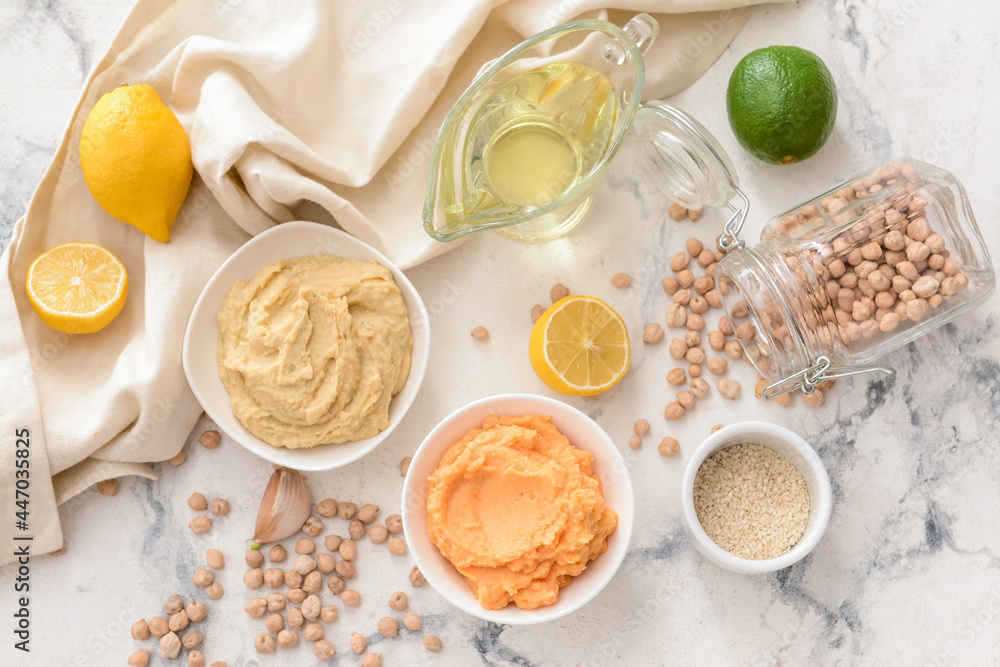Composition with tasty hummus on light background Composition with tasty hummus on light background