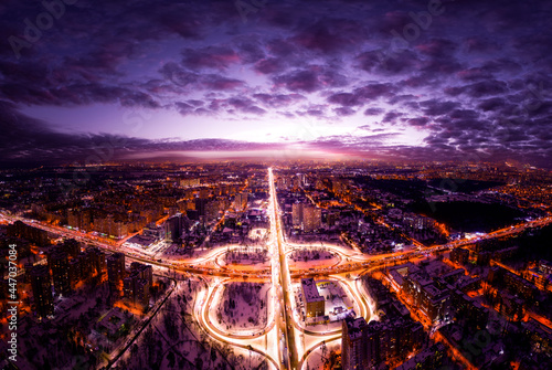 Traffic interchange night city lights drone view