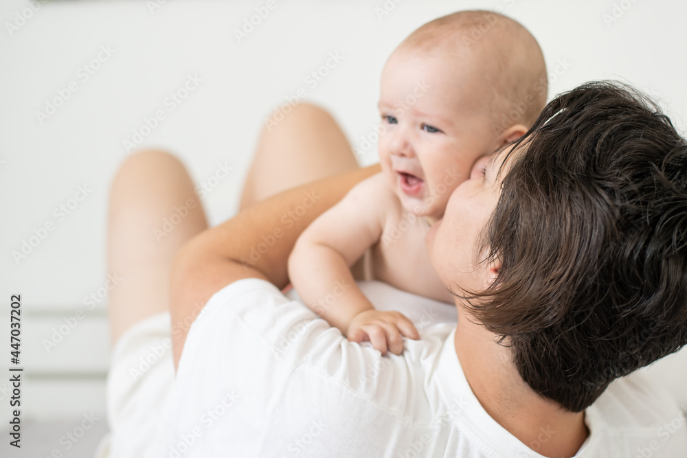 picture of happy mother with baby in hands picture of happy mother with baby in hands