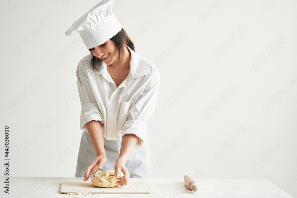 woman baker in chef uniform cooking food kitchen flour products woman baker in chef uniform cooking food kitchen flour products
