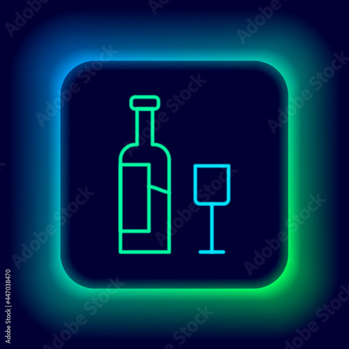 Glowing neon line Wine bottle with glass icon isolated on black background. Colorful outline concept. Vector