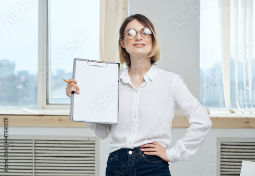 Business woman in glasses in white shirt documents Copy Space