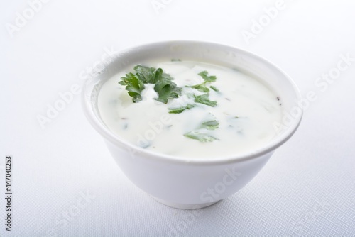 Indian mint yogurt sauce in white background vegan snack Halal menu