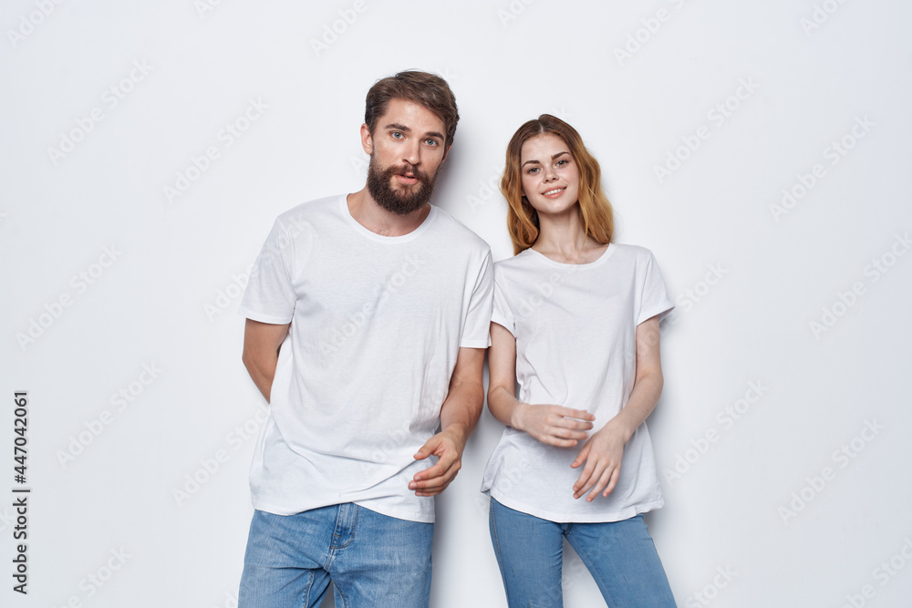 man and woman wearing white t-shirts fashion studio design casual wear man and woman wearing white t-shirts fashion studio design casual wear