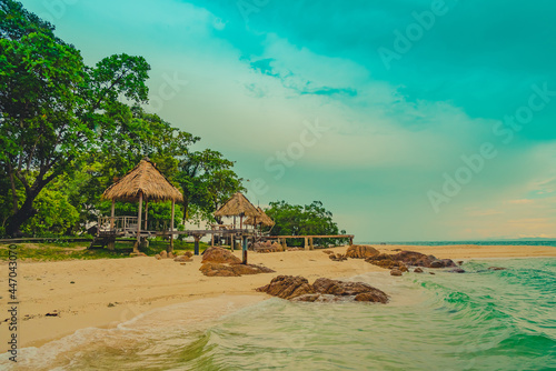 Fototapeta Naklejka Na Ścianę i Meble -  Vintage and retro toning of tropical beach with blue sky and clear sea which including of a wooden boat in sunrise time with vintage retro tone. Vacation time as concept.	