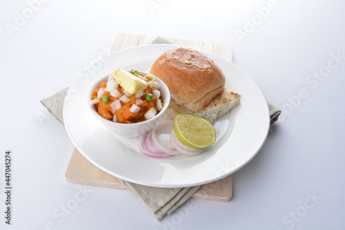 Indian vegetable bean curry with baked bread bun toast in white background vegan dim sum Halal menu