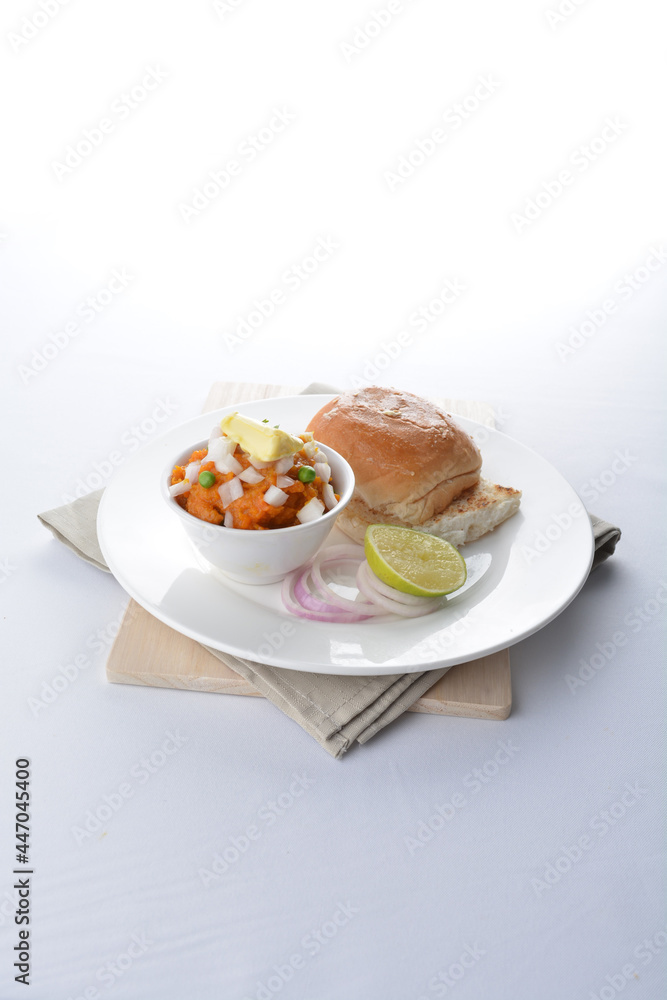 Indian vegetable bean curry with baked bread bun toast in white background vegan dim sum Halal menu