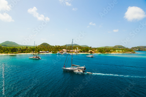 The coast of the island of Martinique in the Caribbean. Yachts, palm trees, beaches and turquoise water. Paradise island of Martinique.