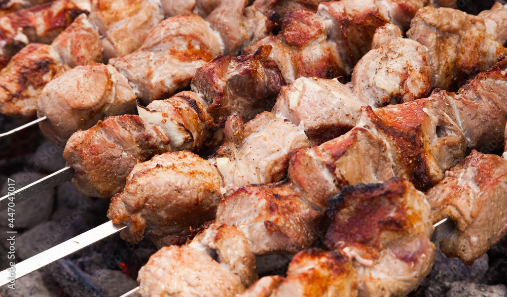 Grilled meat, skewers, charcoal, closeup. Kebabs. Grilled meat, skewers, charcoal, closeup. Kebabs.
