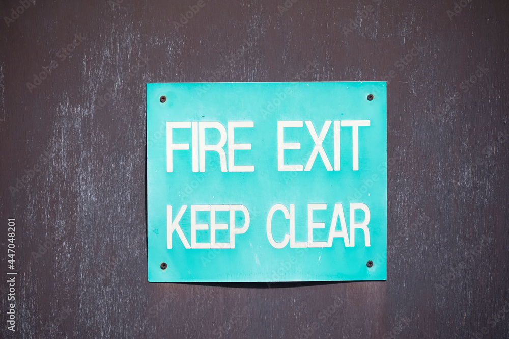 Fire exit keep clear sign on construction building site door Fire exit keep clear sign on construction building site door