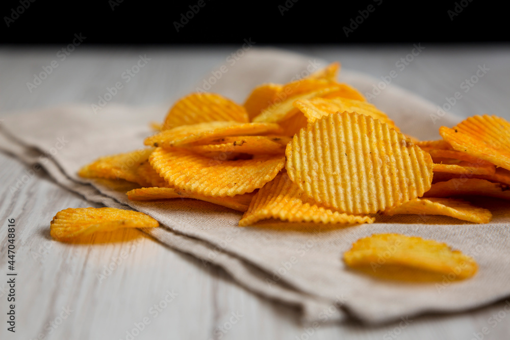 Ruffled Cheese Potato Chips, side view. Ruffled Cheese Potato Chips, side view.
