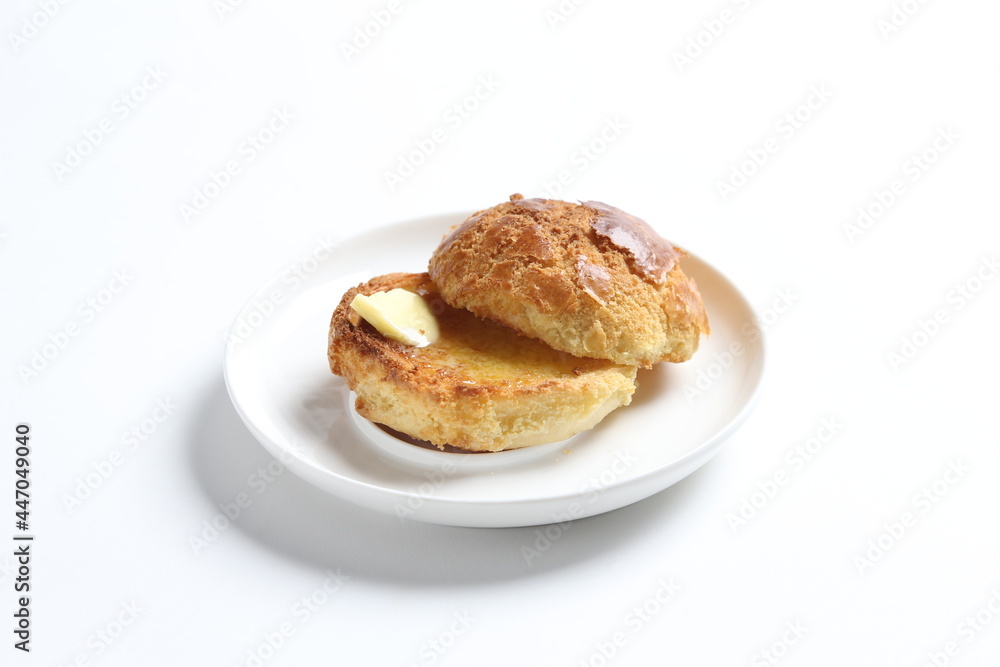 Hong Kong crispy skin polo bun toast with butter and honey jam in white background snack halal menu Hong Kong crispy skin polo bun toast with butter and honey jam in white background snack halal menu