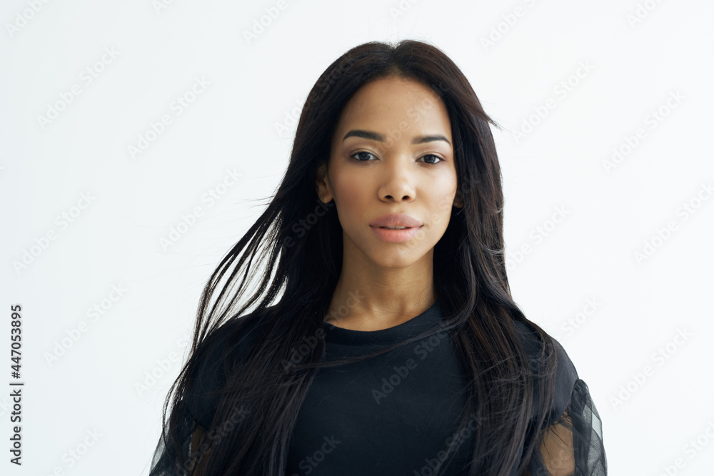 woman of african appearance in black shirt fashionable hairstyle cosmetics glamor woman of african appearance in black shirt fashionable hairstyle cosmetics glamor