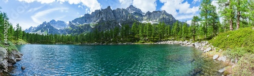The black lake( Lago Nero ): a beautiful alpine lake located within the Alpe veglia - Devero natural park, near the town of Baceno, Italy - July 2021.