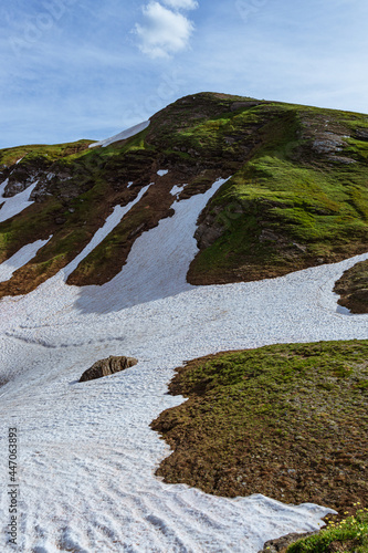 the mountains of the Ossola Valley around dinner time, inside the Alpe Veglia - Devero Natural Park, near the town of Baceno, Italy - July 2021. photo