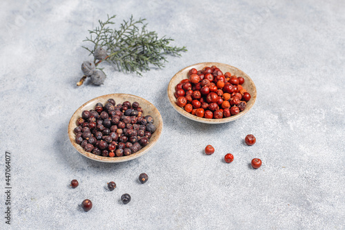 Dried juniper berries in a small bowl.