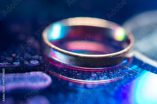 wedding ring on a colored background, magic colors