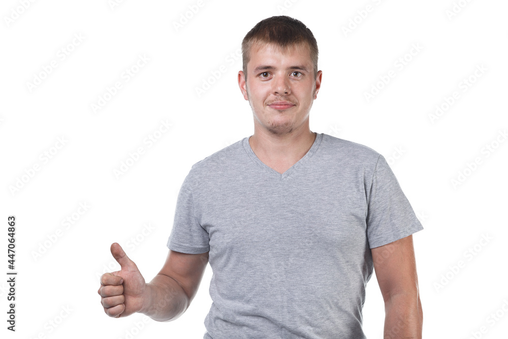 Image of young man with bristle showing thumb Image of young man with bristle showing thumb