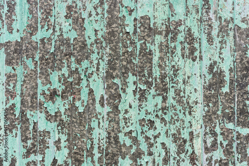 Old peeling paint on galvanized metal sheet, background, texture