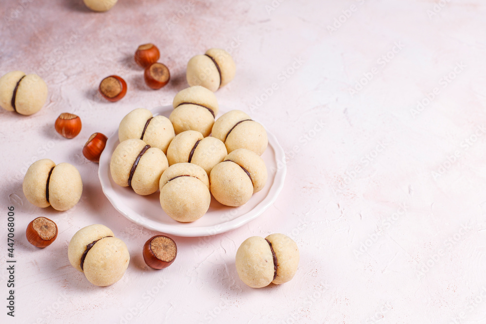 Baci di dama homemade Italian hazelnut biscuits cookies with chocolate.