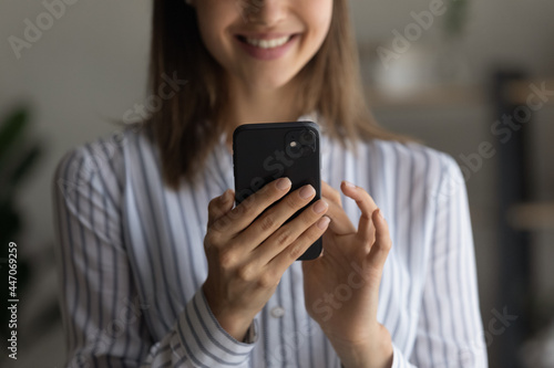 Smiling woman holds smartphone, close up cropped image view. Social media user, retail web services satisfied client, dial number call taxi by phone, modern wireless tech usage, 5g connection concept