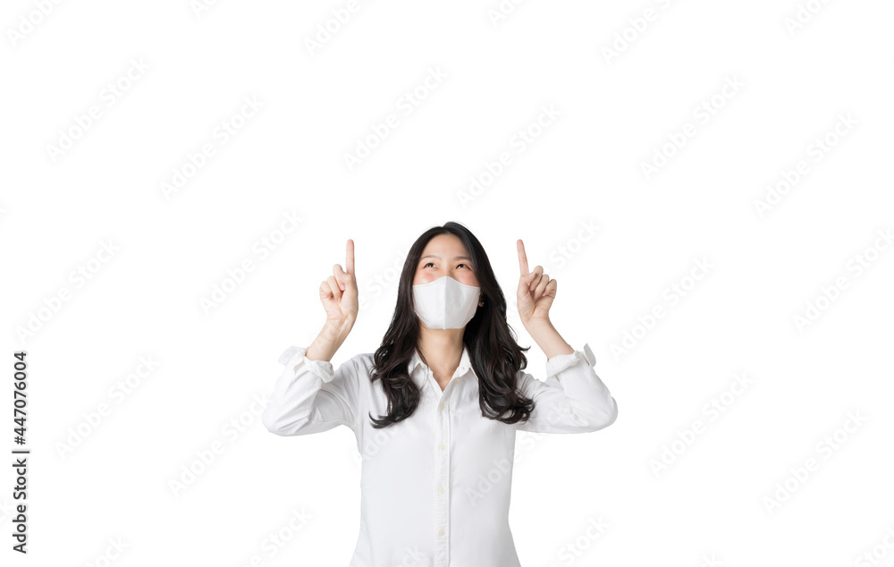 Young Asian woman pointing up and wearing face mask to prevent infection corona virus in isolated on white background Young Asian woman pointing up and wearing face mask to prevent infection corona virus in isolated on white background