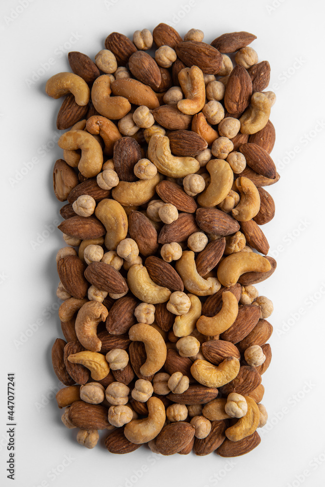A mixture of cashews, almonds and chickpeas. Roasted nuts with salt. High protein product. Healthy dietary nutritional product. Vegetarian balanced meal. Selective focus A mixture of cashews, almonds and chickpeas. Roasted nuts with salt. High protein product. Healthy dietary nutritional product. Vegetarian balanced meal. Selective focus