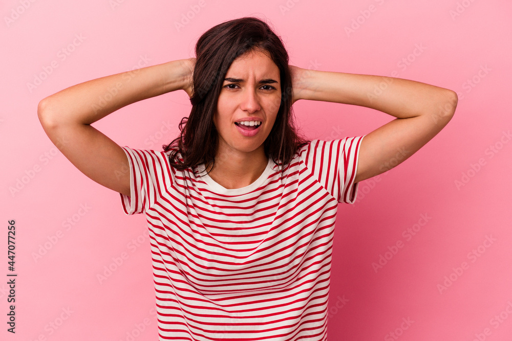 Young caucasian woman isolated on pink background screaming, very excited, passionate, satisfied with something. Young caucasian woman isolated on pink background screaming, very excited, passionate, satisfied with something.