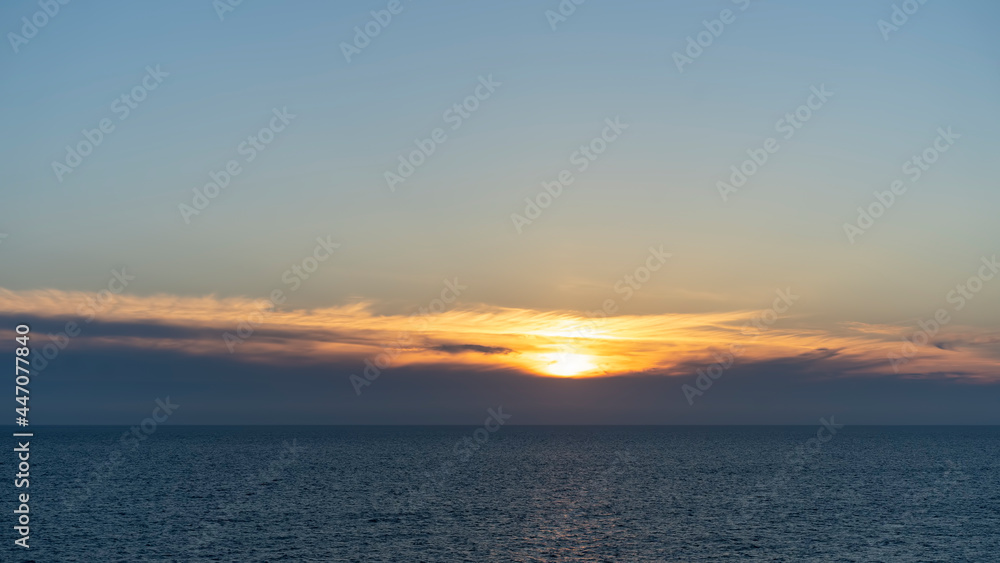 seascape with a beautiful sunset on the background of the sea
