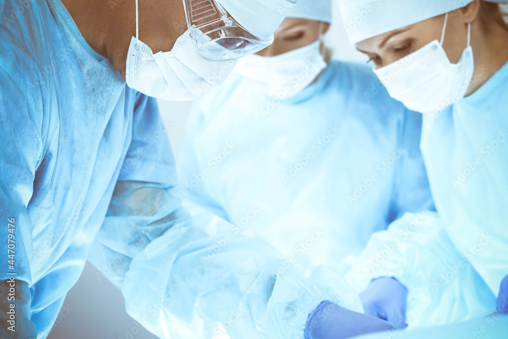Fototapeta premium A group of surgeons is operating at the hospital. Health care concept