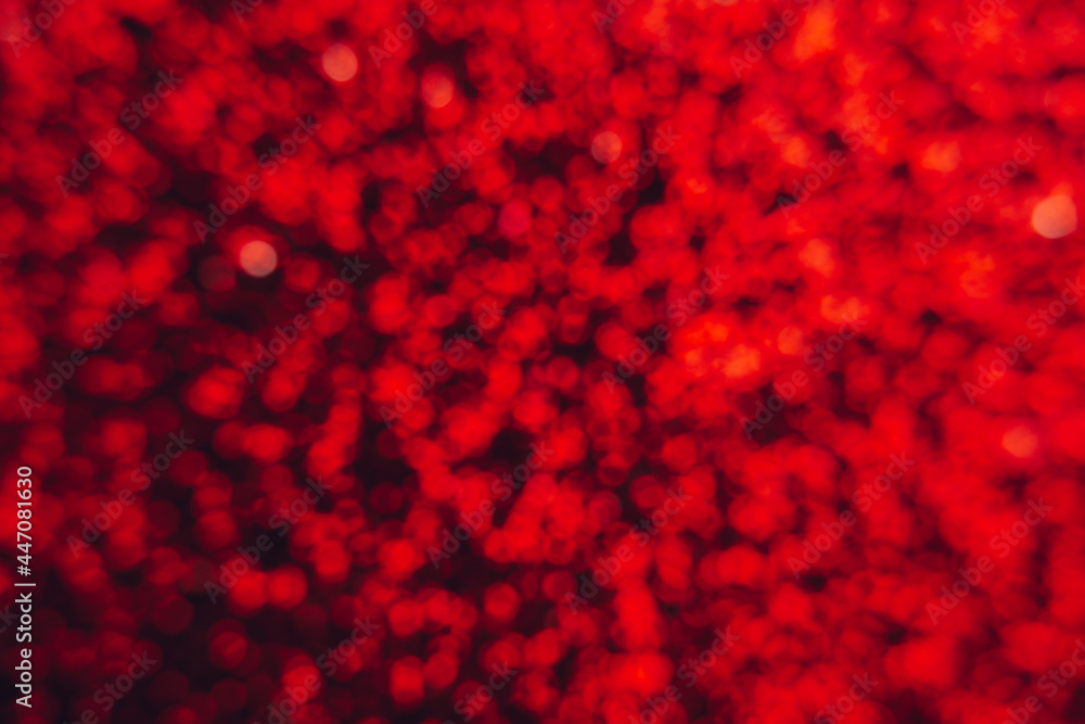 Abstract shiny blurred red background. Textured glittering backdrop Abstract shiny blurred red background. Textured glittering backdrop