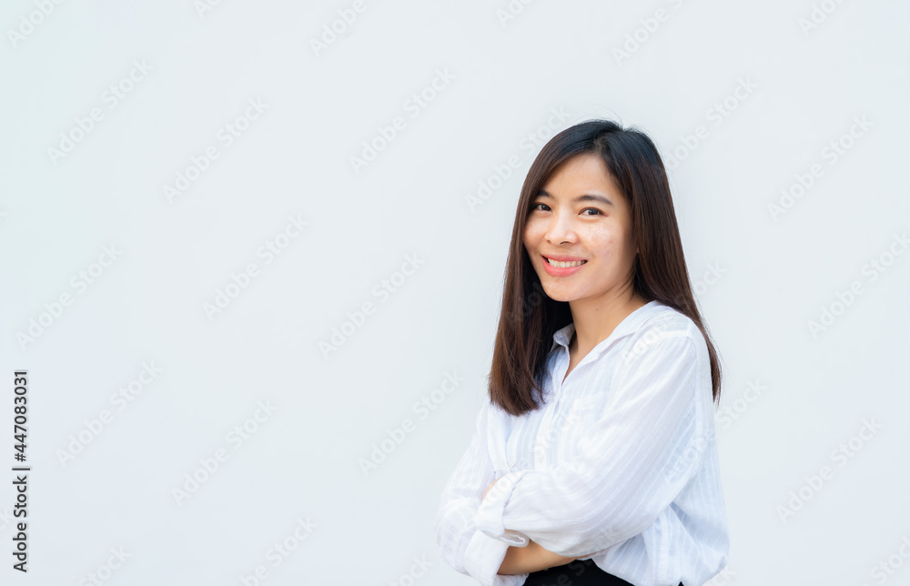close up attractive adult business woman asian girl with happy and smile against white concrete wall office. close up attractive adult business woman asian girl with happy and smile against white concrete wall office.