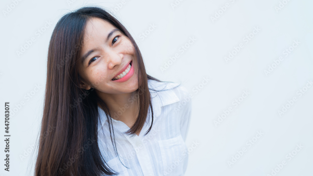 close up attractive adult business woman asian girl with happy and smile against white concrete wall office. close up attractive adult business woman asian girl with happy and smile against white concrete wall office.
