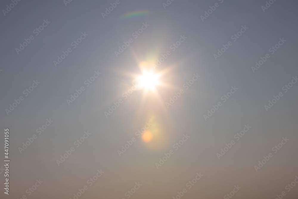 Fototapeta premium sun with beams in the sky as background